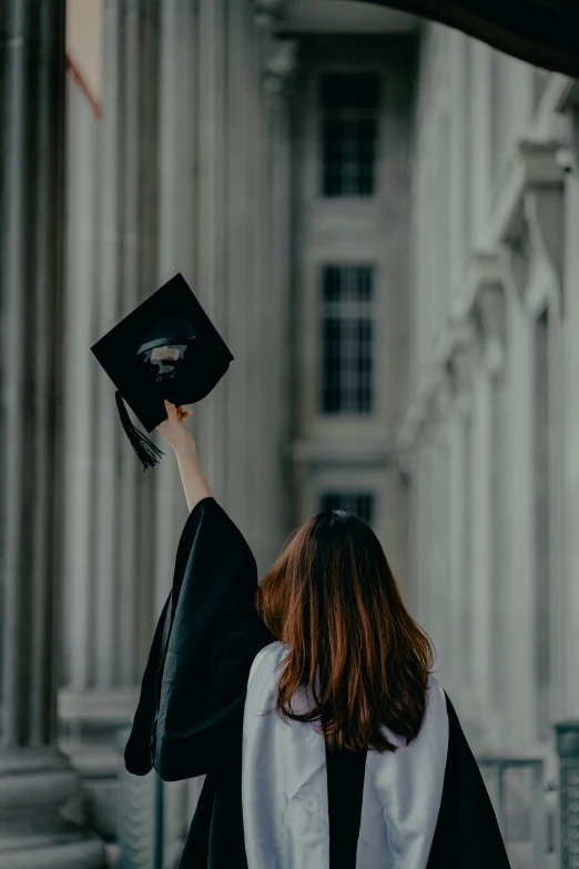 a graduate throwing a tassel up in the air