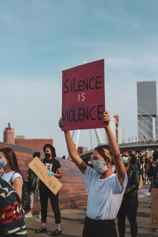 a group of people in the streets holding up signs