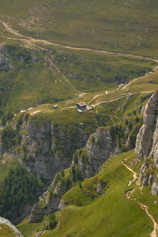 several hills with rocks and grassy areas in the background