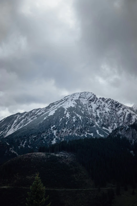 the snow covered mountains are in the distance