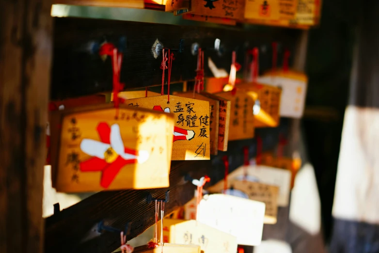 wooden chinese plaques hanging on a wall