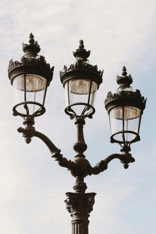 a black and white po of lamps against a blue sky