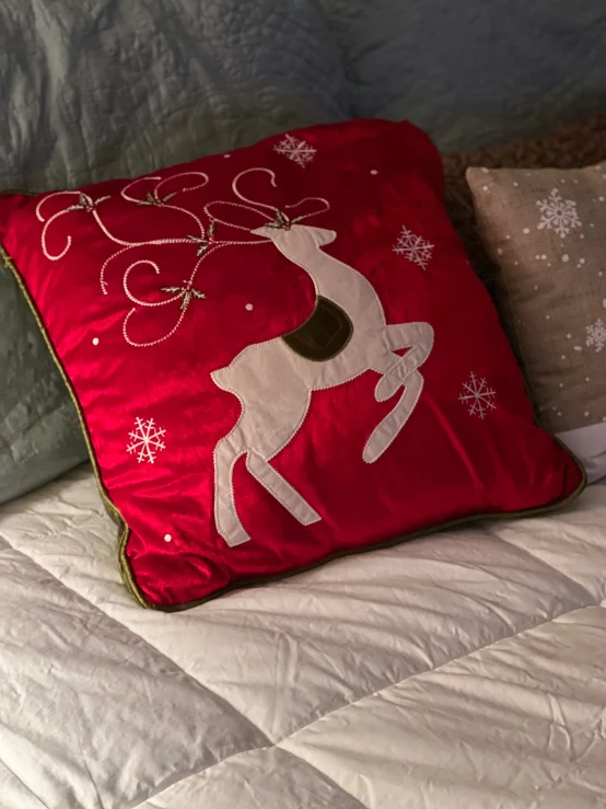 a christmas pillow with deer on it