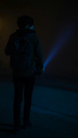 a man walking alone in the dark