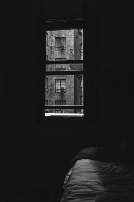 window view of a bedroom with dark walls