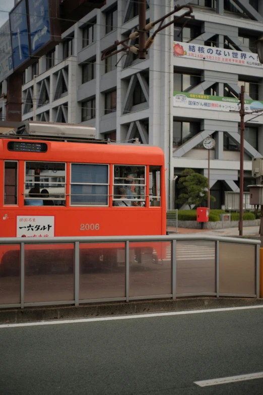 the old passenger train is parked on the street