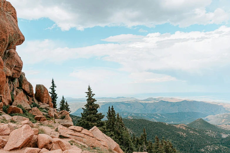 a man on top of a rocky cliff