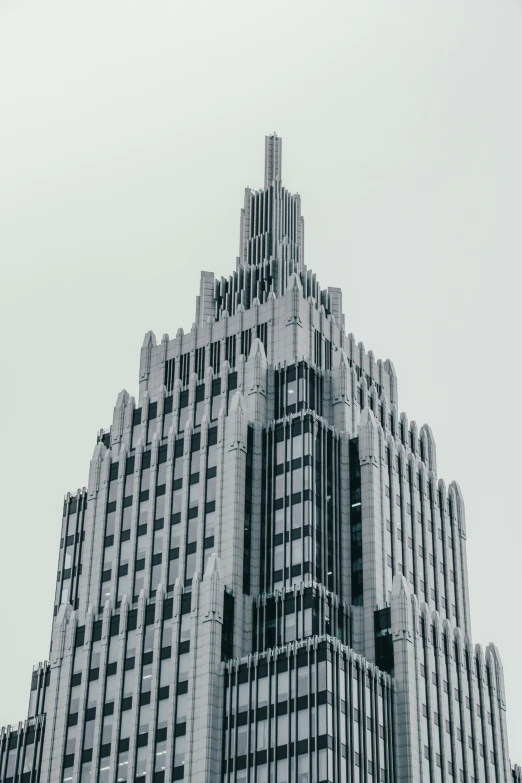 a very tall and colorful building is in a large city