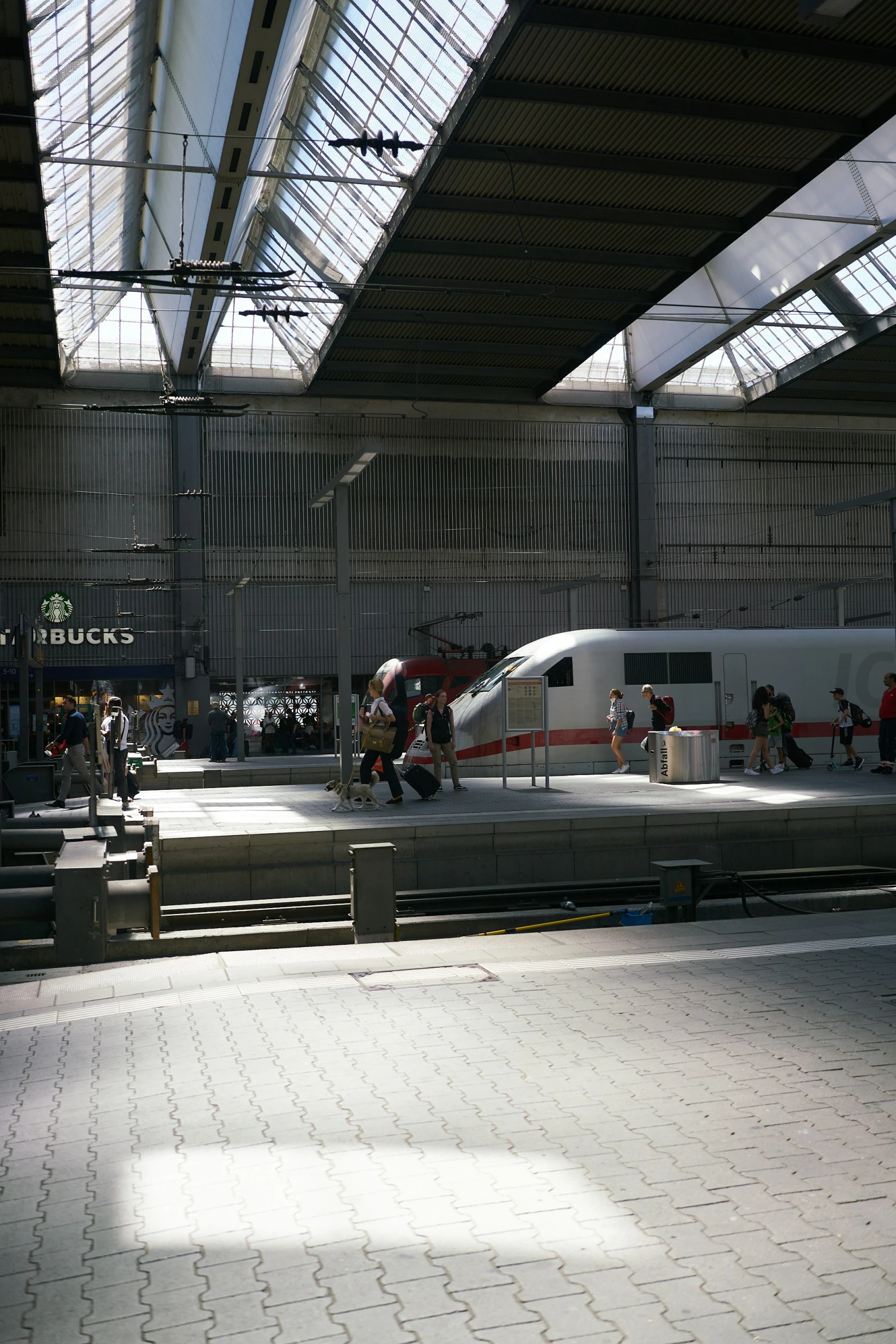 some people are standing on an indoor platform