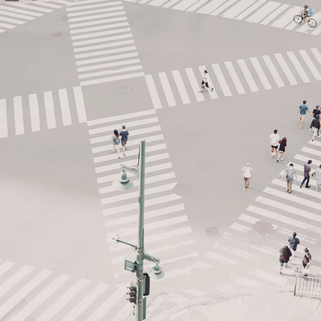 a group of people walking across a crosswalk