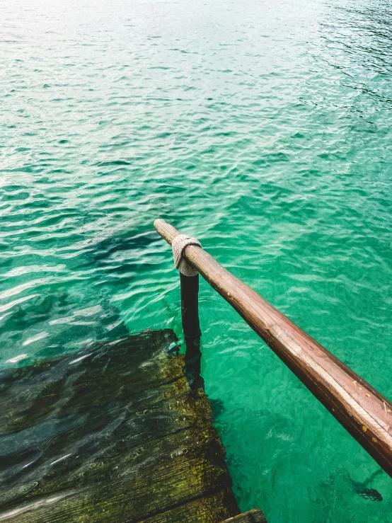 the end of a long dock sticking out into the water