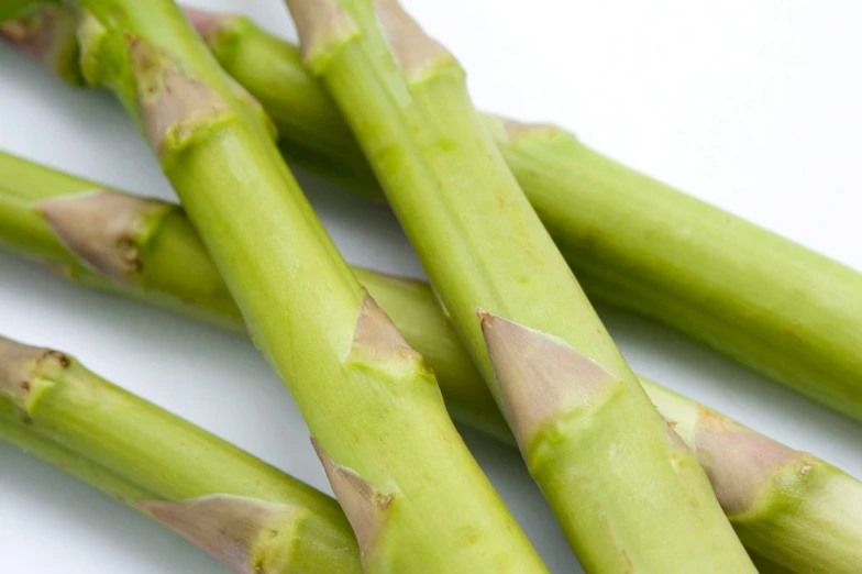 asparagus spears are lined up together on the table