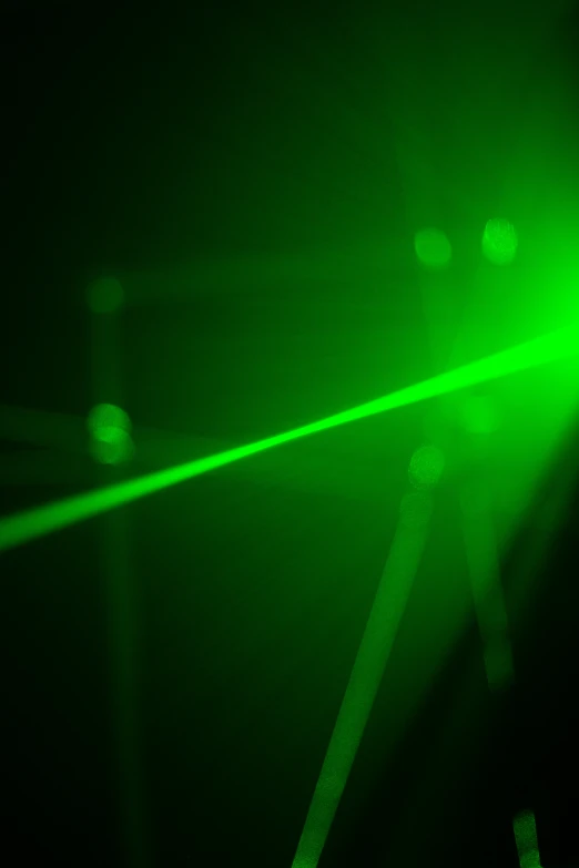 the green laser appears to be shooting through space