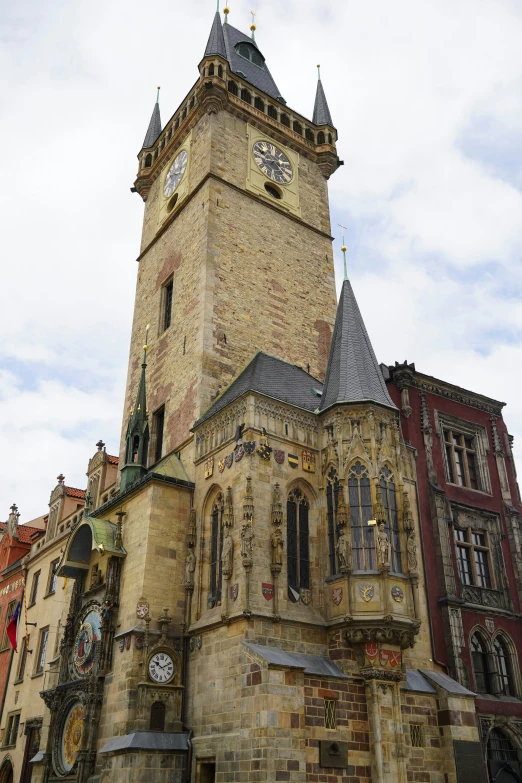 an old stone clock tower in europe with two steeple tops