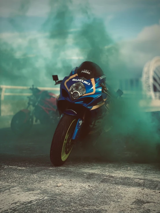 motorcycle in a smoke filled track during a race