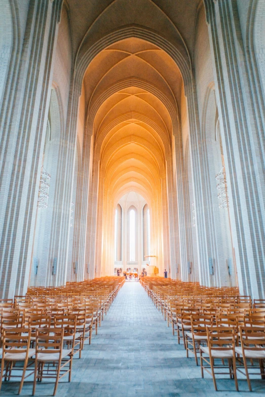 the inside of an ornately decorated church with pews