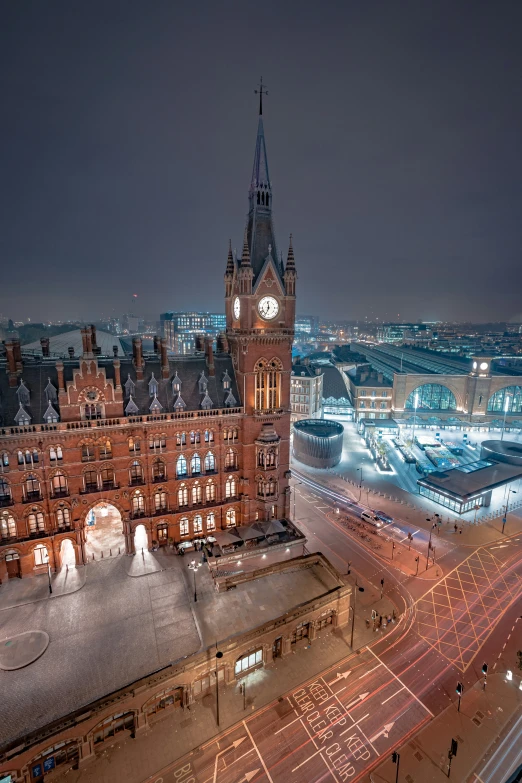 a night time view of a very tall building