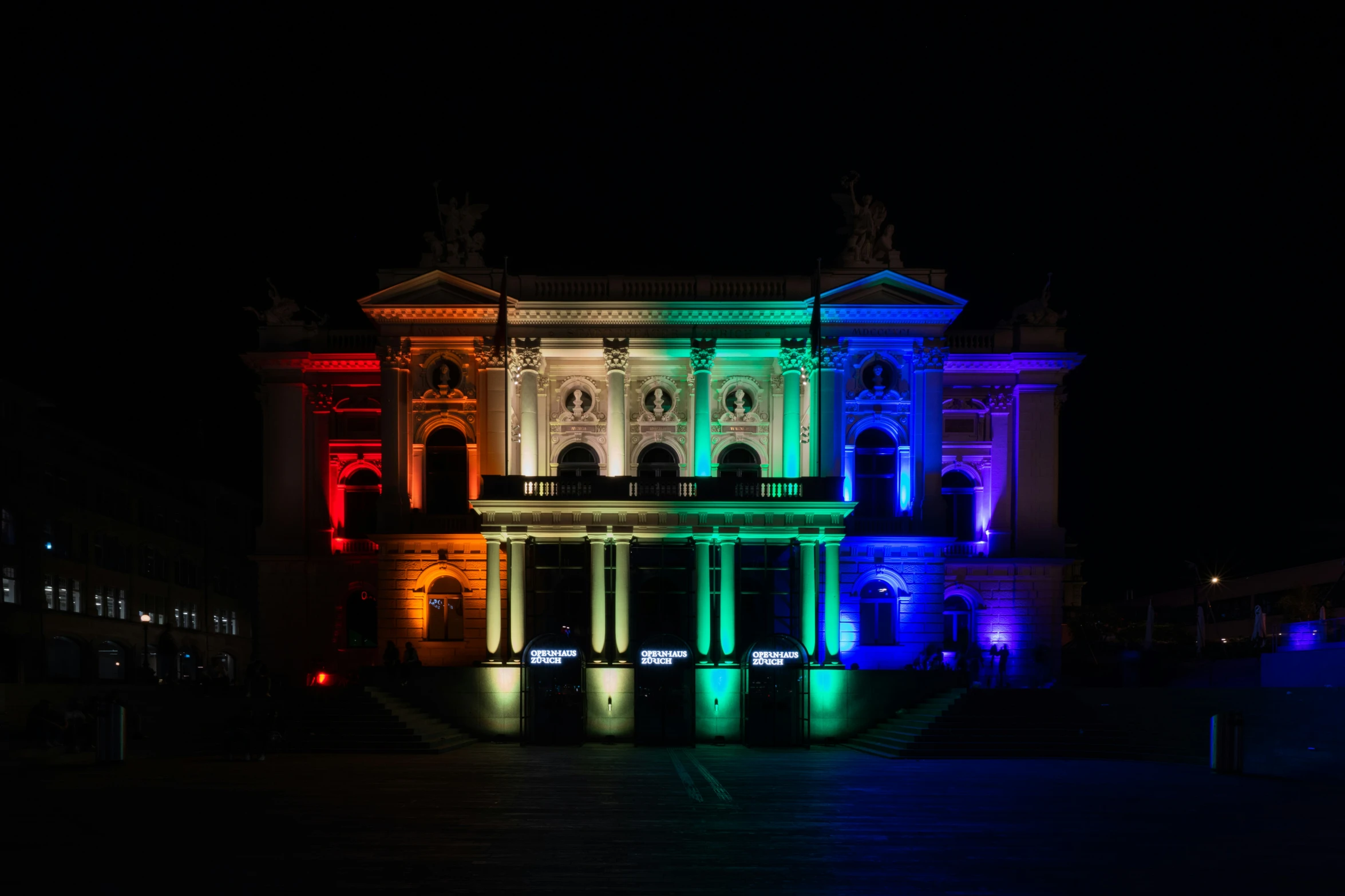 a building with many lights around it at night