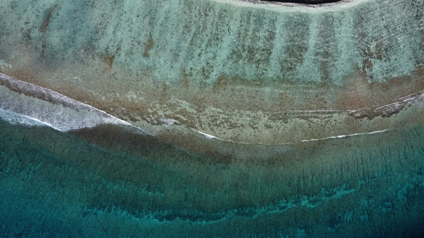 aerial po of blue ocean water with landline