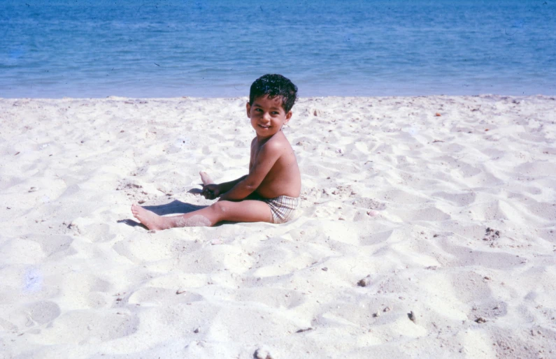 a  on a beach with an ocean in the background