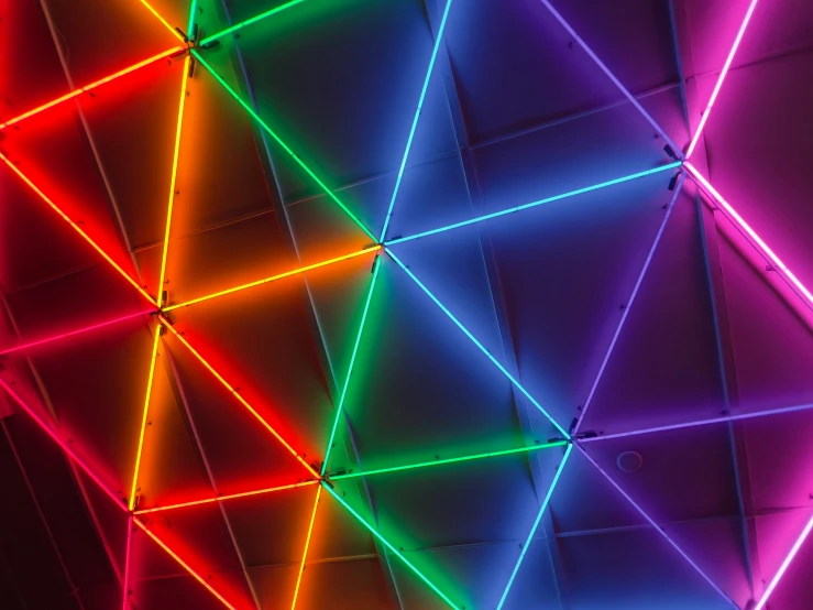 a bright display of triangles against a black background