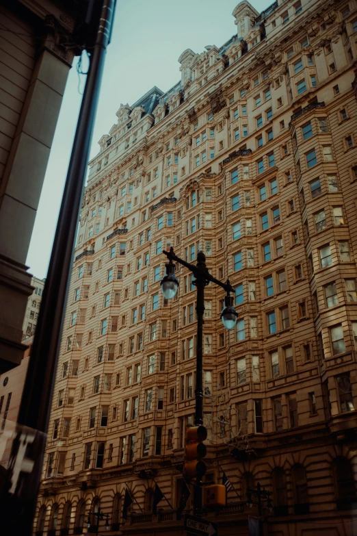 an old - fashioned building, the west end buildings and a street lamp stand tall in the city