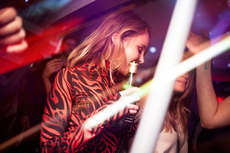 woman lighting up a candle in her mouth