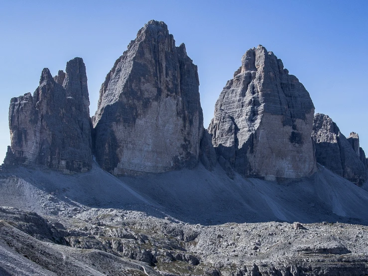 a mountain range with many tall towers in the distance