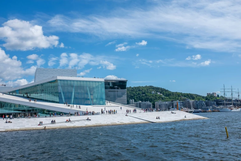 a large building is sitting on the shore