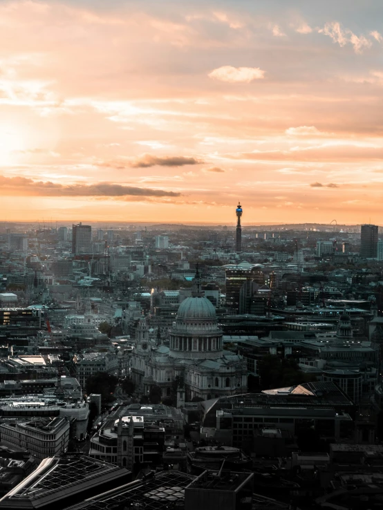 an aerial view of a large city in the sun setting