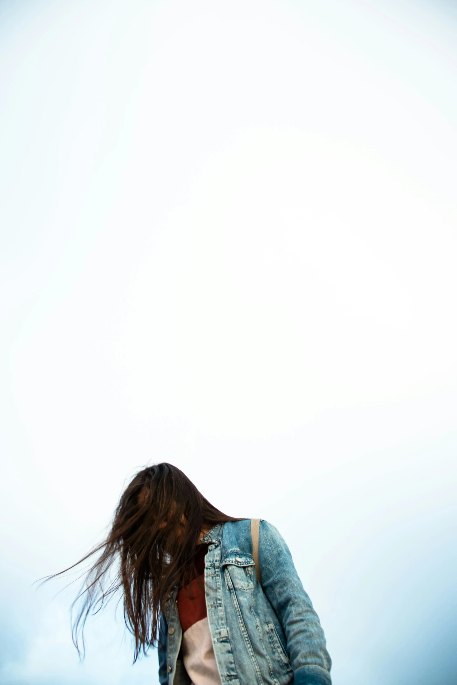 a close up of a woman with a denim jacket and pants