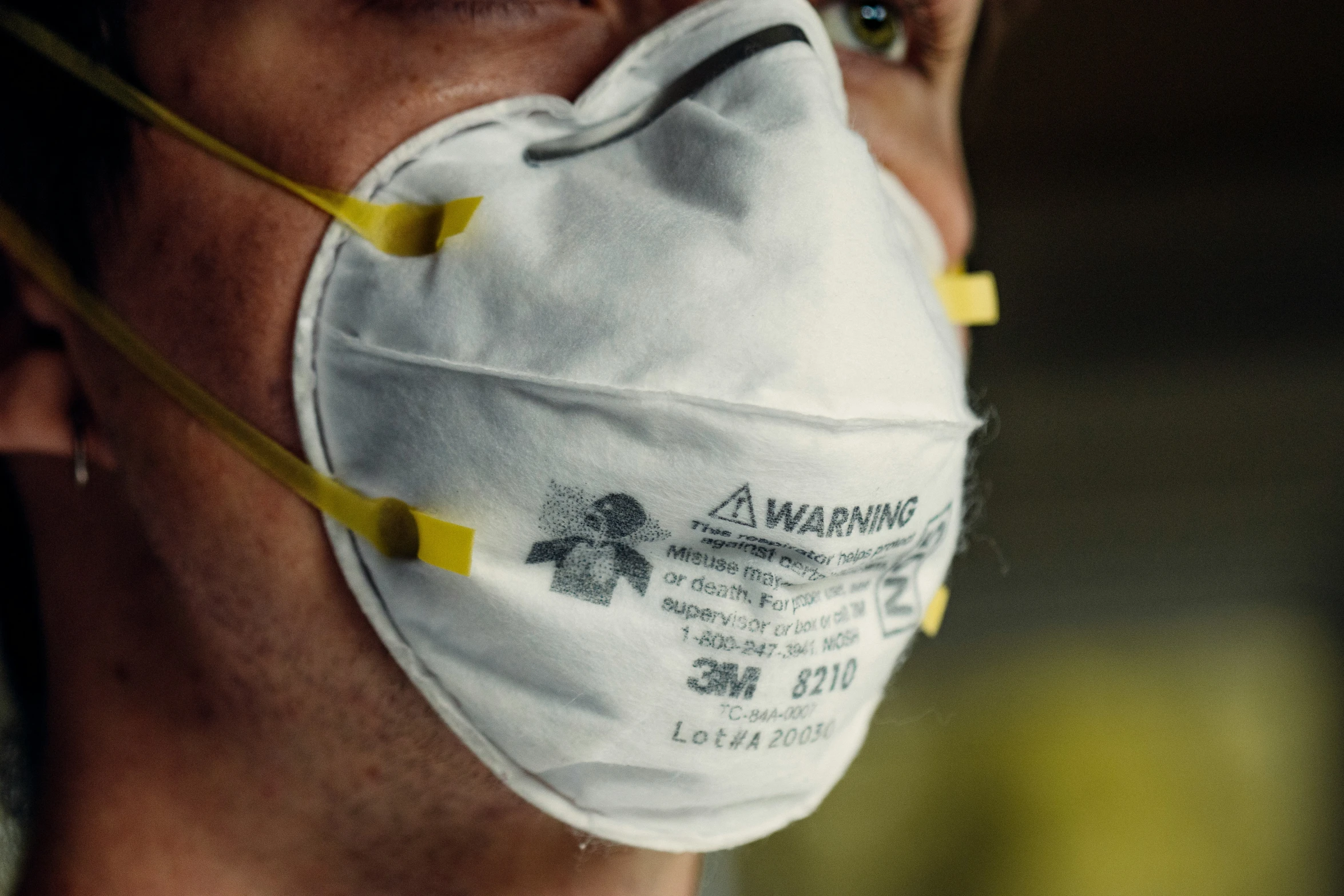 close - up of a man wearing a face mask