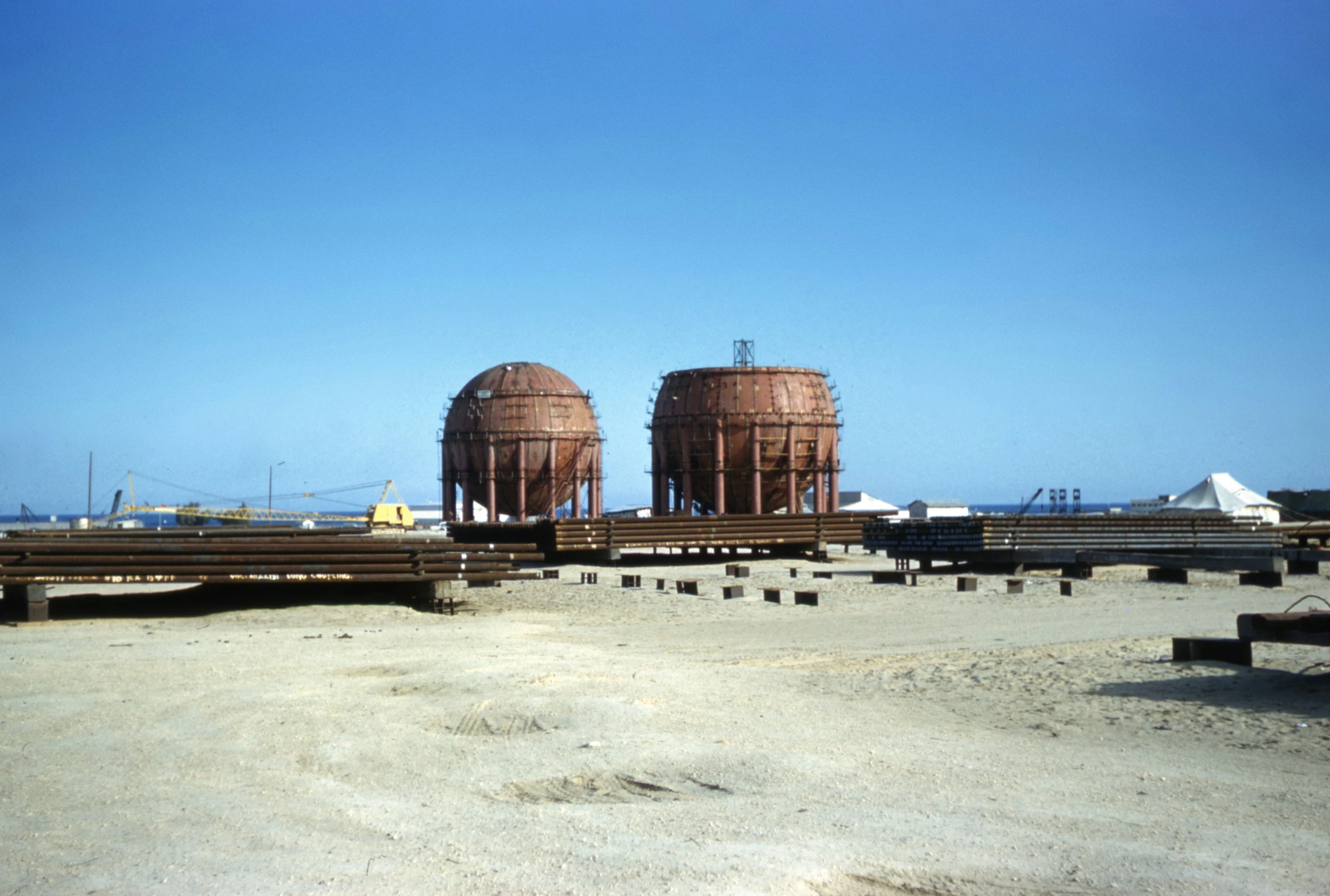 two large metal tanks sitting side by side