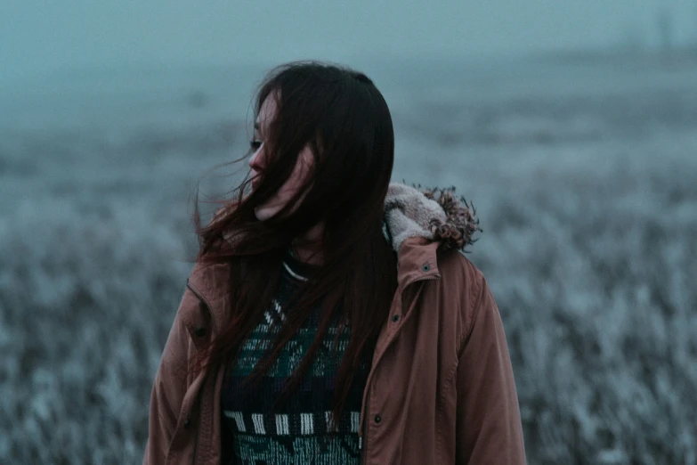 a woman with her hair in the wind