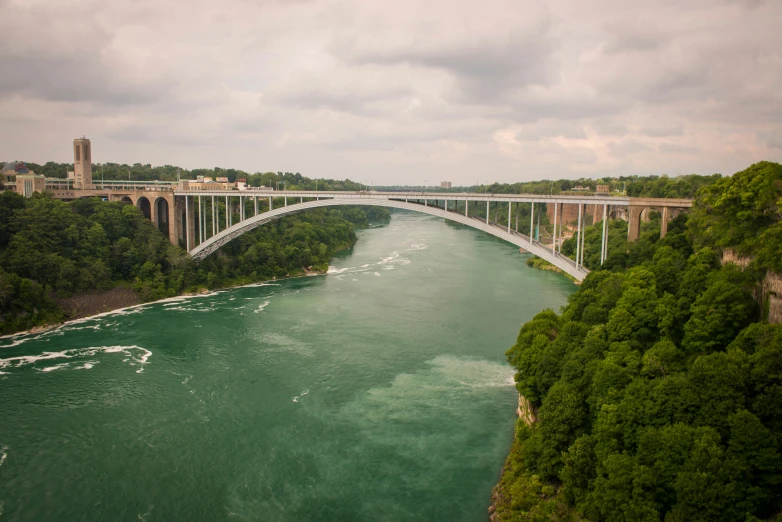 an aerial view of a bridge and river