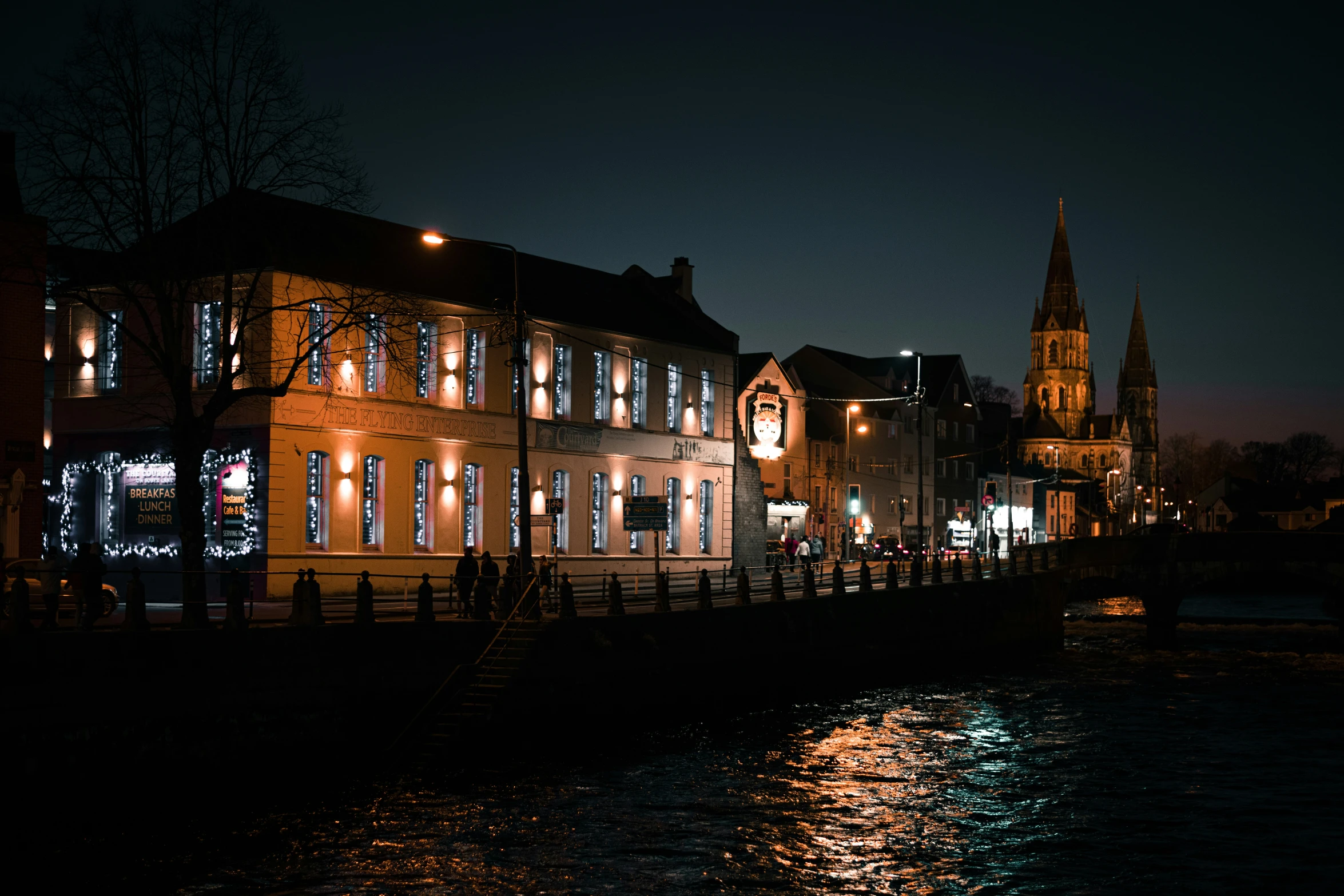 an old historic town lit up at night