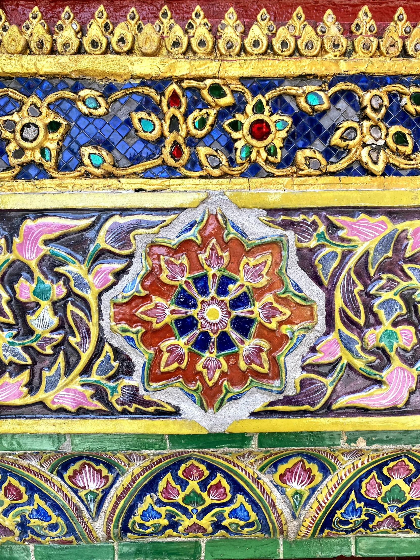 colorful pattern on a building with ornate carvings