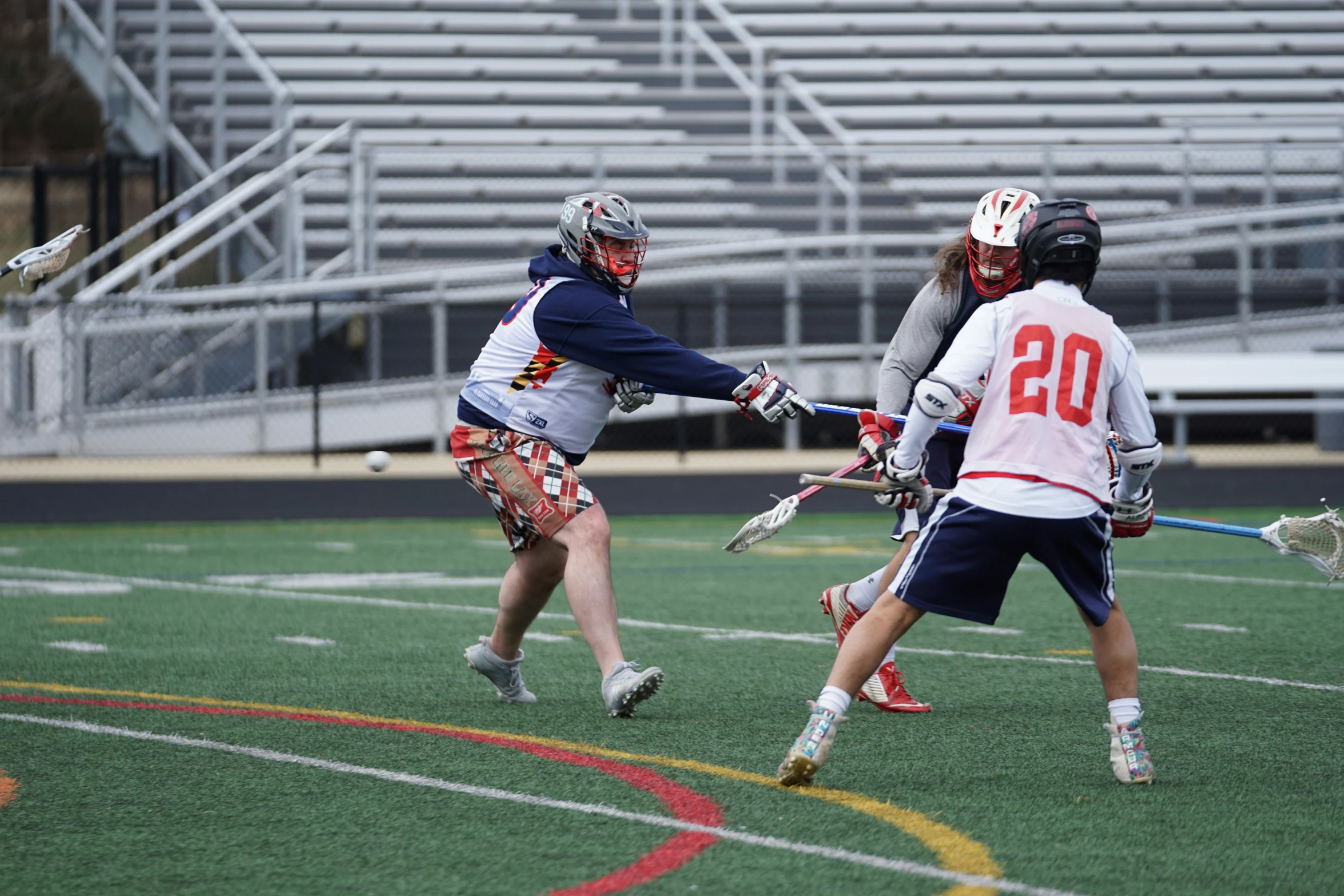 a group of people playing a game of field hockey