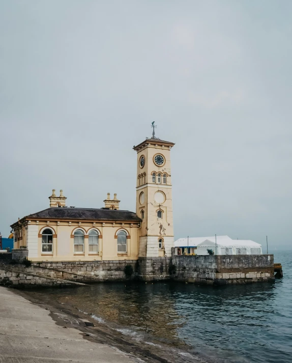 a small building with a clock in the middle