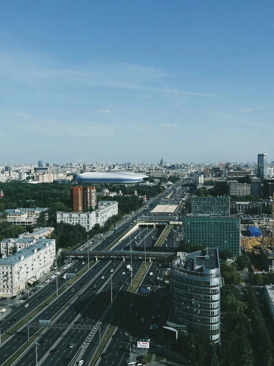 a street has two lanes going through it with many traffic and buildings