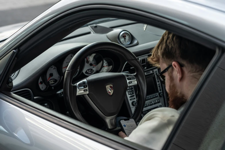 a man wearing a headset while driving in his car