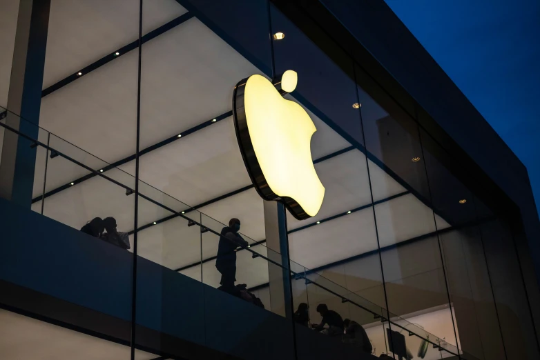 an apple store with a big yellow sign