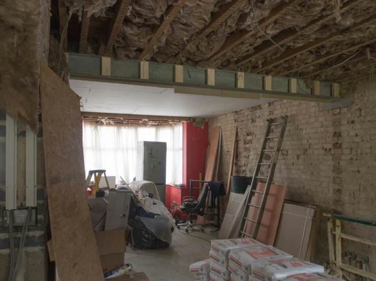 several room being constructed in the shape of a house