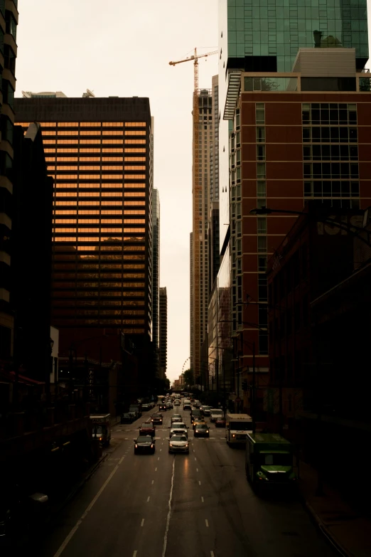 a street full of traffic near some tall buildings