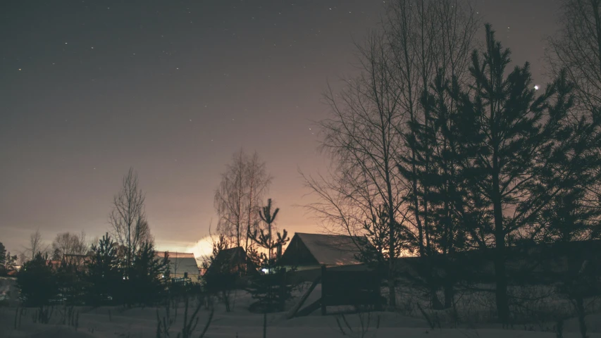 the moon shines brightly in the night sky