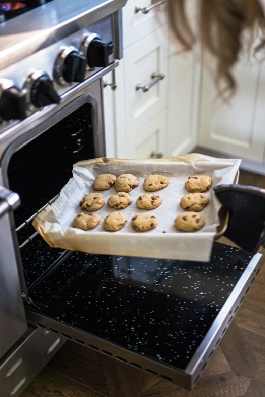 a tray filled with cookies in an oven