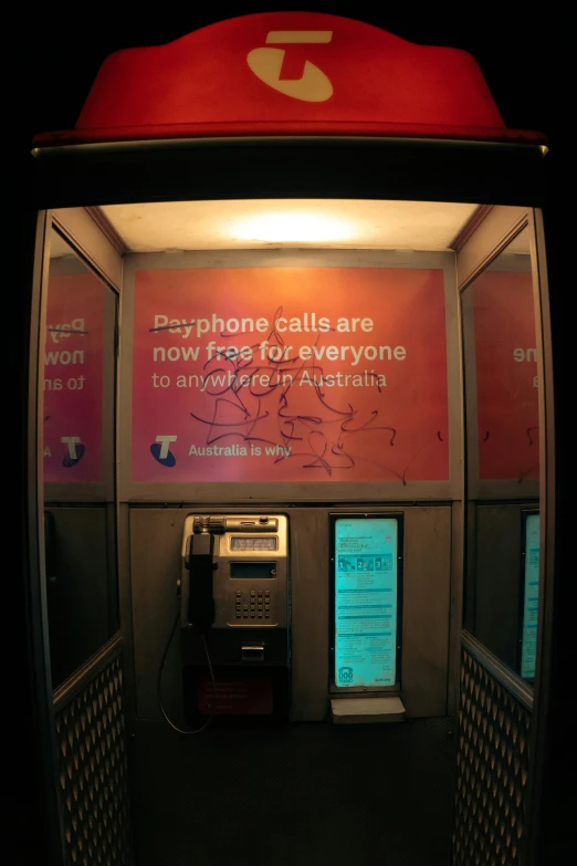 a very unique phone booth that lets someone pay at a fast food restaurant