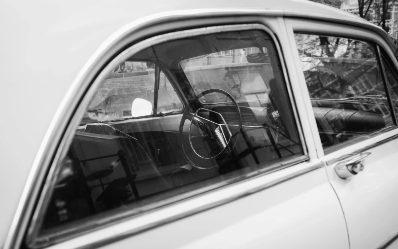 a man is seen from inside a vehicle as he drives