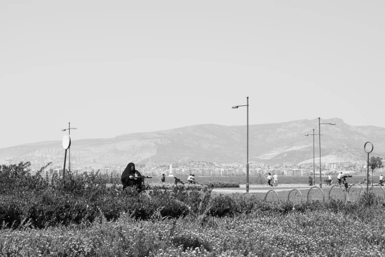 the man is riding his bicycle in the field