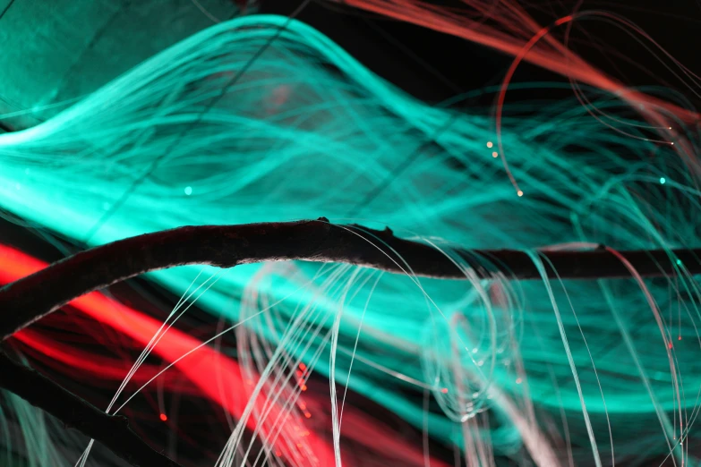 a blurry image of light streaks in blue, red and green
